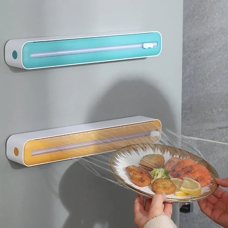 Kitchen wrap holder with built-in cutter