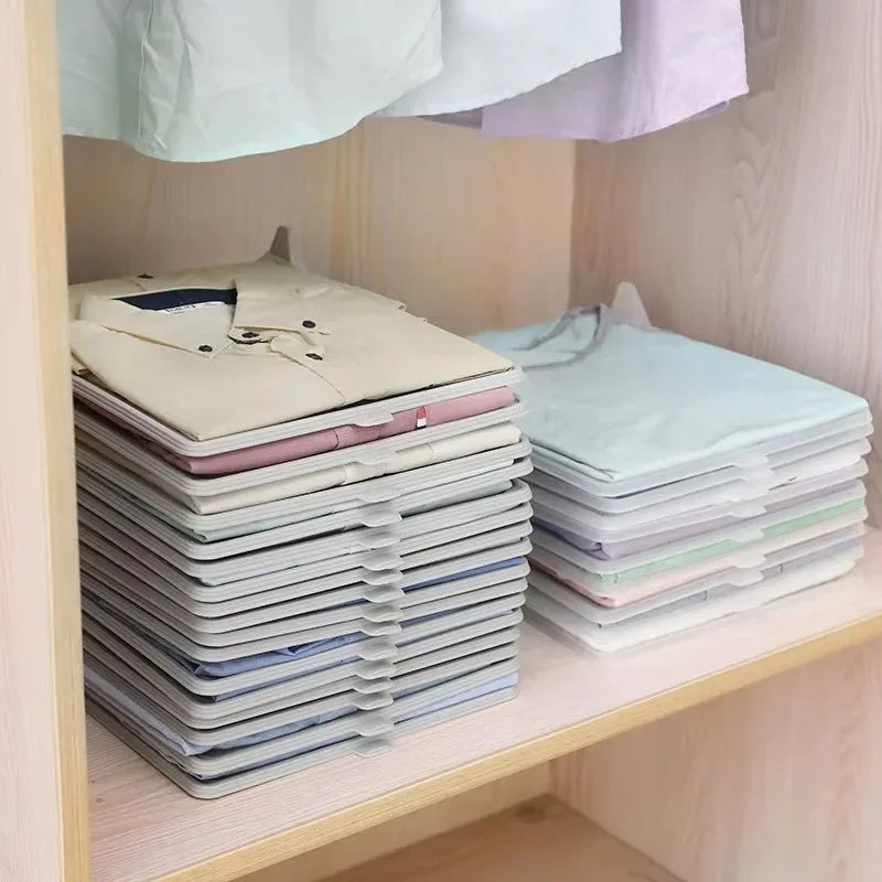 Stacks of folded shirts on a wooden shelf with a light background grandline retail